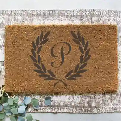 Personalizirani ulazni tepih s inicijalom
